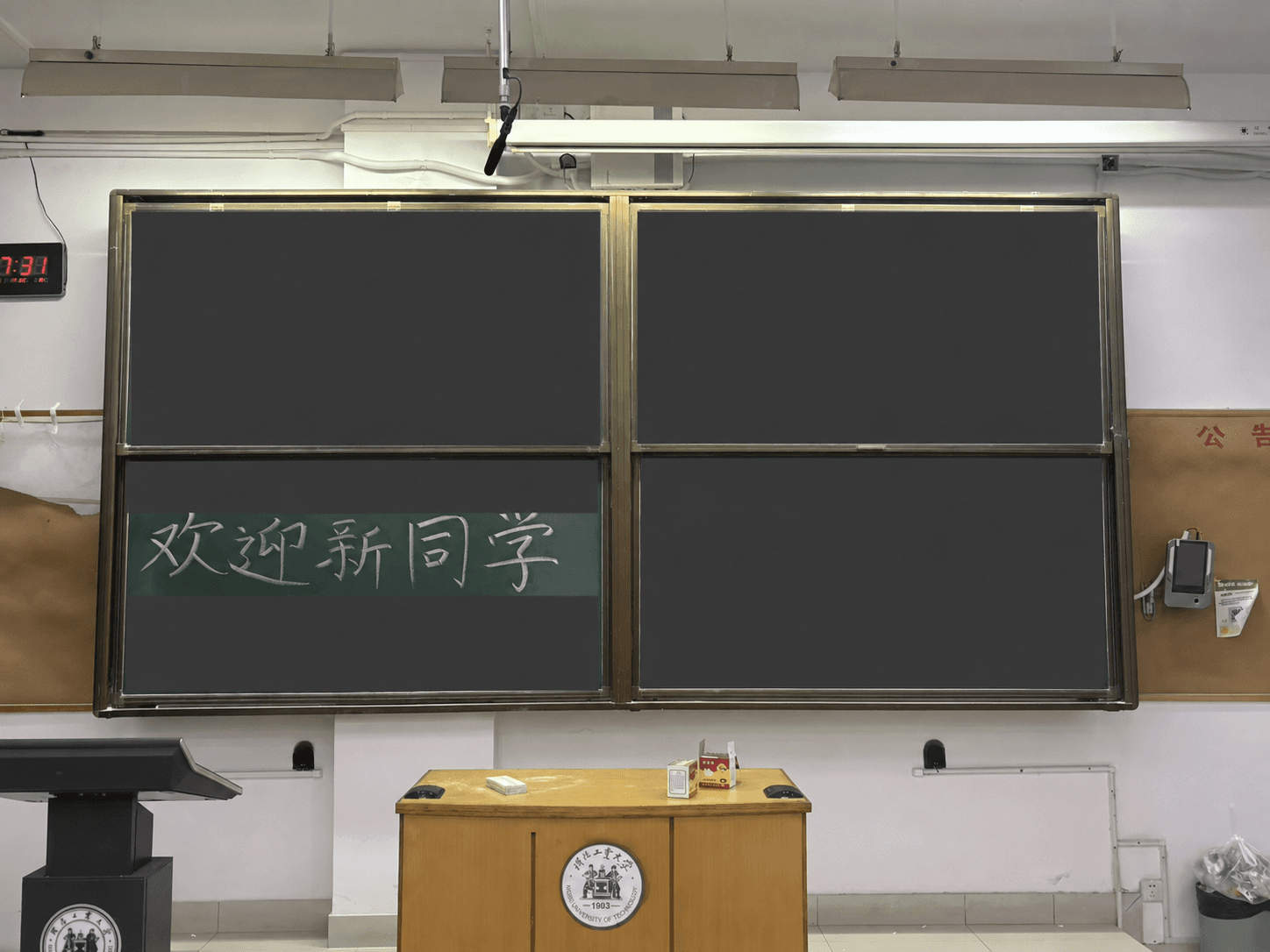 The classroom blackboard at the freshman welcome meeting, with the welcome message visible and other handwritten information covered