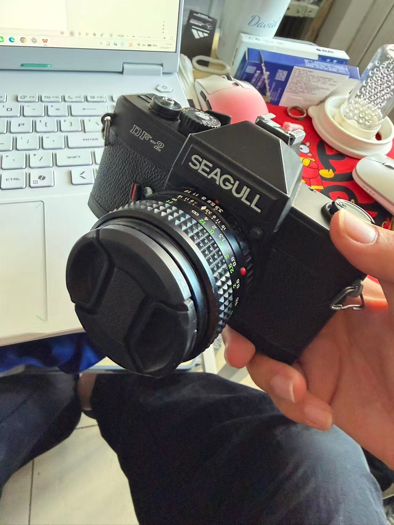 Holding the Seagull DF-2 camera given to me by Lao Qin