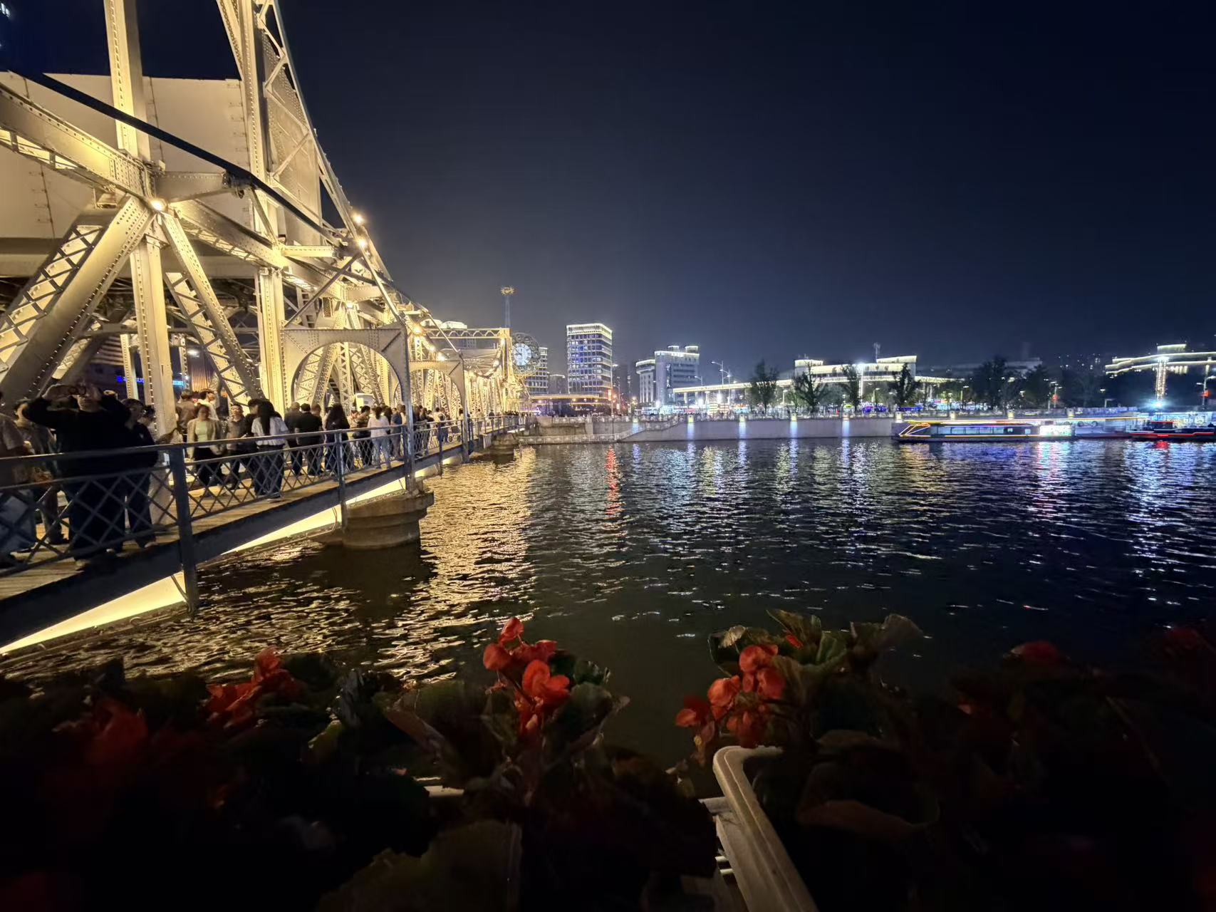 Jiefang Bridge and the Haihe River at night, with city lights reflected on the water
